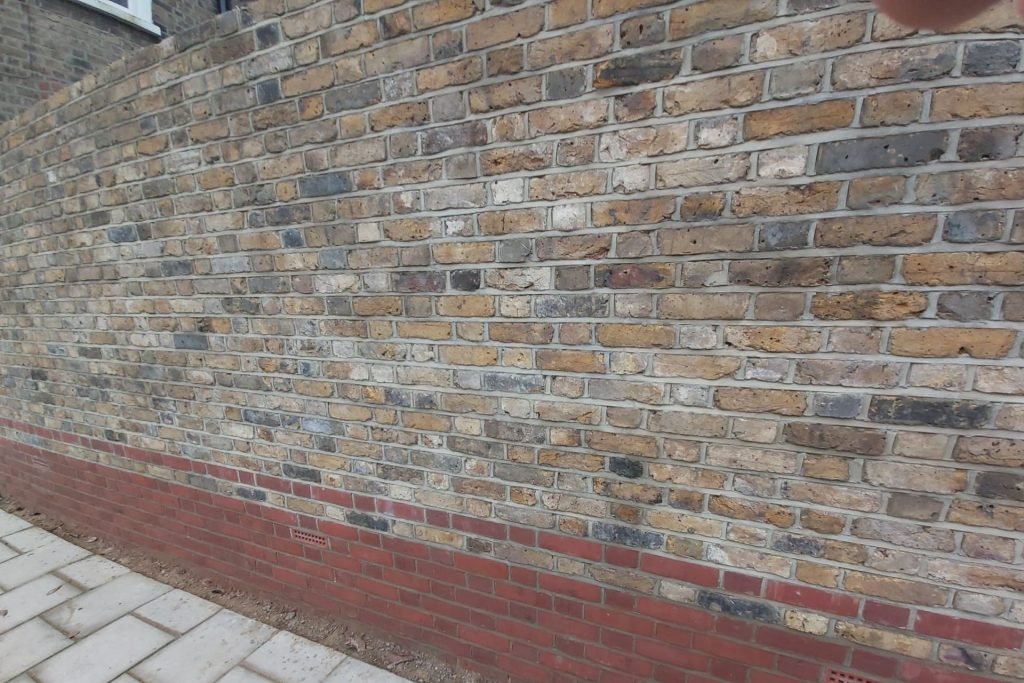 Wall built from reclaimed bricks